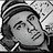 Pixelated grayscale image of a stylized face with closed eyes, dark hair, and visible mouth details against a patterned background.