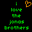 Green pixelated text reads "i love the jonas brothers" on a black background with an orange heart symbol above the first line.