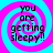 Four identical display text over a pink and cyan spiral background with pixelated edges