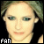 A pixelated image of a person with light brown hair and blue eyes, featuring red X overlays on some sections.