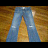 A static image shows blue denim jeans on a wooden floor with cyan text asking if someone wants to pay $60 for ripped jeans.