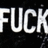Pixelated white text spelling "FUCK" on a black background with scattered gray speckles.
