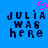 Blue background with dark blue pixelated text reading "JULIA WAS HERE" and a pink pixelated heart symbol above the text.