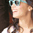 Two women wearing sunglasses appear in a split-screen view with one woman's face partially visible on the left and another woman's face on the right.
