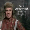 A person in a brown plaid shirt and light-colored cap stands against a dark background with text reading "I'm a Lumberjack and I'm alright..."