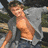 A four- shows a shirtless man with an open gray jacket, dark hair, and blue jeans in the top-left; a close-up of his face in black-and-white on the top-right; a seated figure in a white sweater with arms crossed below left; and empty space to the right