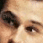 A 48x48 pixel animated contact sheet showing three sampled frames of a person with light brown hair and fair skin, wearing a dark shirt against a white background.