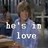 Pixelated static image of a person in a blue shirt with overlaid white text reading 'be is to love' against a dark background.