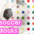 A soccer ball with black and white sits on a background of multicolored dots, overlaid with text in pink, red, blue, and white