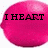 A pink lemon-shaped icon with black text reading "I HEART PINK LEMONS!" displayed across three