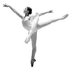 Black-and-white image of a dancer in a white leotard performing a high kick with one leg extended upward and arms outstretched.