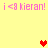 Yellow background with pink text reading 'i <3 kieran!' repeated four times and three pixelated hearts in red and orange.