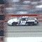 Animated sequence showing multiple racing cars on a track with blurred background motion, each car displaying number 12.