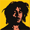 Pixelated static image of a person with dark hair against a yellow background, featuring visible dithering and color blending in the face and hair.