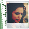 Static image of a person with dark hair and red lips in a polaroid-style frame with green text on the left edge.