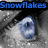 A close-up of a person's eye with blue-tinted eyelashes and a snowflake-like pattern on the eyelid, accompanied by blue text reading "Snowflakes that fall on her eyelashes <3".
