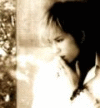 A sepia-toned animated contact sheet showing three sequential frames of a child in traditional clothing with subtle pose changes and one frame containing text overlay.