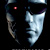 Pixelated static icon of a stylized metallic mask with glowing red eye, dark background, and light blue/white reflective surface.