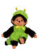 Green monkey-like character in green overalls with yellow bow tie and black sleeves, wearing green hat with yellow antennae, shown in four distinct poses against gray background.