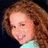 A pixelated image of a person with long curly brown hair on the left, next to green background with black text reading 'AGNUS LIKES' and a heart symbol.