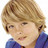 Pixelated close-up of a person with light brown hair and blue clothing against white background.