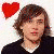 A person with light brown hair appears in four distinct visual states: a color version with red heart symbol, black-and-white versions showing hand gestures and different backgrounds.
