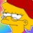 Yellow cartoon character with red hair, white eyes, and a neutral expression against a multicolored background.