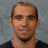 Pixelated portrait of a man with short brown hair and light stubble, wearing a dark shirt against a gray background, alongside text reading "Michal Rozsival #28" and the Pittsburgh Penguins logo.