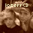 Pixelated image of a person with light brown hair and closed eyes, overlaid with white text reading 'loserr<3' against a dark brown background.