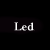 Pixelated text 'Led Zeppelin' on black background with white and gray lettering.