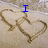 Two heart shapes drawn in sand with blue text reading "I .R AND A MY FRIEND" overlaid on a textured background.