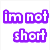 Pixelated text 'im not short' in purple outlined white letters on a white background, with colorful smiley face icons below.