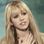 Pixelated close-up of a person with long blonde hair, light skin, and blue eyes, wearing a dark choker necklace against a muted teal background.