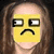Yellow square emoji face with downturned mouth and side-glancing eyes overlaid on a person's face with brown hair.