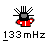 Pixelated character with black head and red jacket, two versions showing different head positions above '133mHz' text.