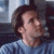 Pixelated image of a person with dark hair wearing a light blue shirt, positioned next to green background text reading 'Original Icons .com'.
