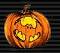 Four orange pumpkins with carved yellow faces on a black striped background, each displaying distinct facial expressions and shapes.