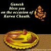 Ganesha icon with text 'Ganesh bless you on the occasion of Karwa Chauth' and a golden plate with offerings, showing animation changes in flame and candlelight.
