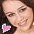 Pixelated static image of a person's face with a pink heart icon overlay in the bottom-left corner.