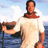 Static pixelated image of a person in ancient-style clothing standing near water with a cloudy sky background.