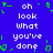 Blue background with white pixelated text reading 'oh look what you've done' repeated twice, surrounded by green pixelated border elements.