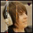 A person with brown hair and headphones appears in a of six , each showing slight variations in head position and facial expression