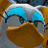 Pixelated character with blue and white headgear, gray face, brown mouth area, green eyes on left side of image; right side shows green text 'Original Icons .com' on dark background.