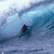 Pixelated static image of a surfer riding a wave with blue and white tones, appearing as a low-resolution AIM buddy icon.