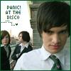 A static image shows a person in a white shirt and dark tie with two others in the background, alongside text reading "PANIC! AT THE DISCO" in pixelated font.
