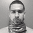 Black-and-white image of a person with short hair wearing a patterned neck scarf, displayed in four showing slight variations