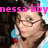 Pixelated image of a person with dark hair holding a blue and red object near their face, with pink text overlay reading 'nessa bby' against a dark background.