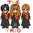 Pixelated image of three figures in dark robes with red-and-gold scarves, labeled "THE TRIO" above and below.