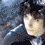 A pixelated animated sequence shows a person with dark hair and light skin transitioning from neutral to smiling expressions against a blue-toned background.
