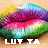 Pixelated lips in rainbow gradient colors with white text 'LUTTA' below on a light brown background.
